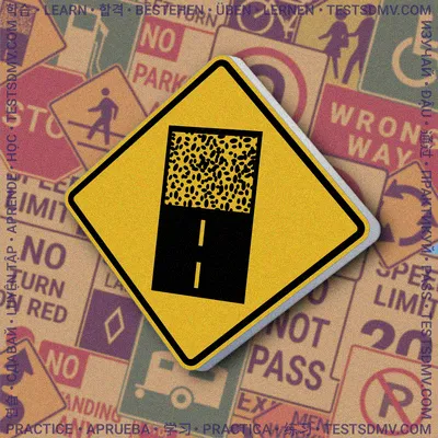 A yellow diamond-shaped sign with a black border, showing a symbol of a paved road surface that transitions into a speckled, unpaved surface.